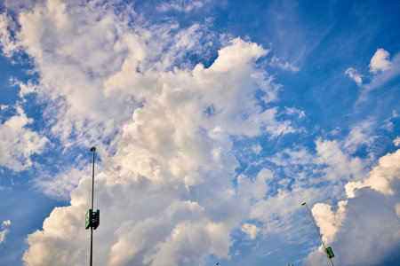 Blue sky background with white clouds. Cumulus clouds in the blue sky.の写真素材