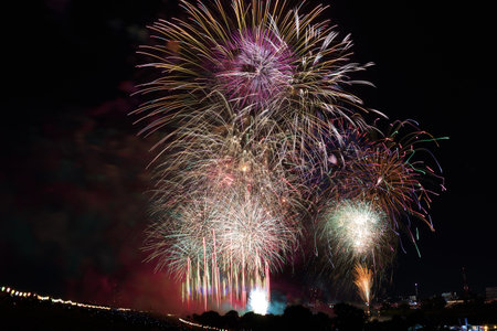 Colorful fireworks of various colors over night sky, celebration and anniversary conceptの写真素材