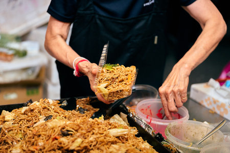 Fried noodle on street food market in Bangkok, Thailand.の写真素材