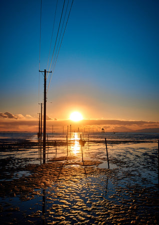 Sunset at the beach in Phetchaburi, Thailandの写真素材