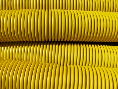 Yellow big plastic grooved pipesの写真素材