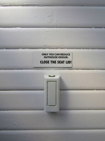 Close the seat lid sign at outdoor bio toilet