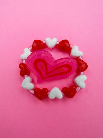 Pink Heart in the circle of white and red heartsの写真素材