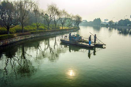 Garbage boats on the water on the Beijing-Hangzhou Grand Canalのeditorial素材