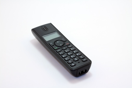 Modern digital black cordless phone at the white backgroundの写真素材