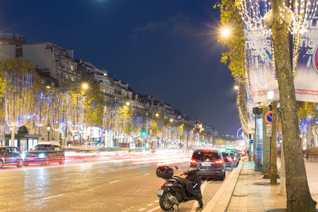 Paris; France-November 23, 2015 : The Christmas decoration on Champs Elysees avenue, blurred motion cars in Paris, France.のeditorial素材