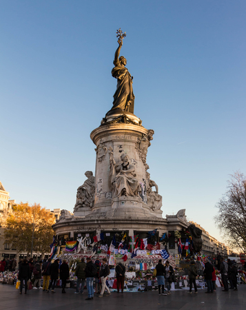 Paris; France-December 04, 2015: The statue of Mariannewho symboloises the spirit of the French Republicbedecked with banners and placards in commemoration of the victims 13 November terrorist attacks.のeditorial素材