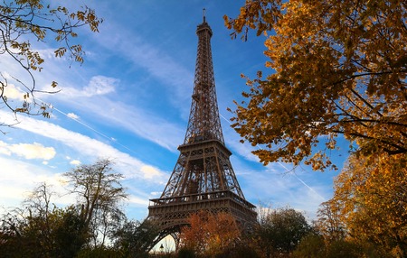 Color fall image of the Eiffel tower in Paris, France, Europe, on a sunny autumn day .