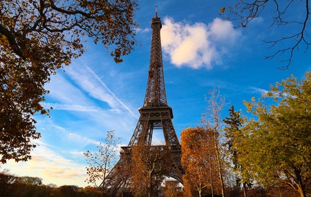 Color fall image of the Eiffel tower in Paris, France, Europe, on a sunny autumn day .の写真素材