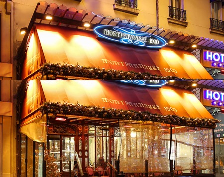 The typical Parisian cafe Montparnasse decorated for Christmas in the heart of Paris. Christmas is one of the main Catholic holidays, which is celebrated on a large scale throughout.のeditorial素材