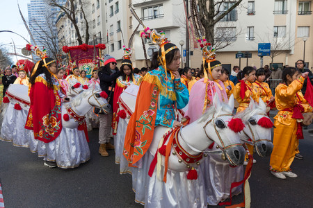 The Chinese performers in traditional costume at the chinese lunar new year parade in Paris, France.のeditorial素材