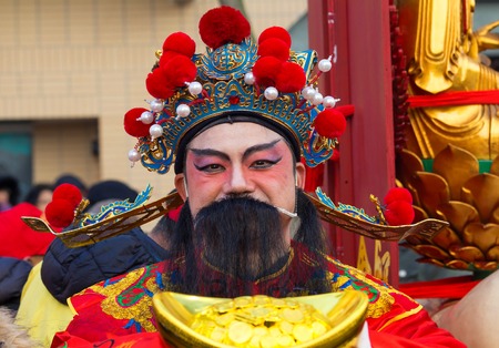 The Chinese performer in traditional costume at the chinese lunar new year parade in Paris, France.のeditorial素材