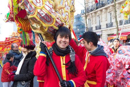 The performer in traditional costume at the chinese lunar new year parade in Paris, France.のeditorial素材