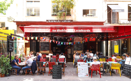 View of typical Parisian paris cafe Au diable des Lombards in the quarter Chatelet.のeditorial素材