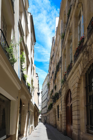The narrow street in the Marais district, Paris, France.の写真素材