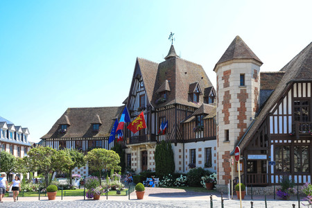 Decorated with flags and flowers Town Hall in Deauville, France . Deauville Town Hall was restored in neo-Norman style in 1961 by Mayor Robert Fossorier.のeditorial素材