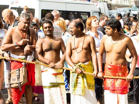 The devotees celebrating the Ganesha hindu festival- Ganesh Chaturthi in the streets of Paris.のeditorial素材