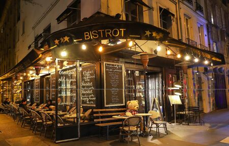 View of typical French cafe Fontaine Sully in the quarter Marais, the historic Parisian district set on the Right Bank .のeditorial素材