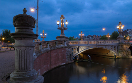 Blauwbrug Blue Bridge over Amstel river in Amsterdam at spring evening, Holland.の写真素材