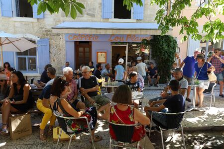 View of tourists eating in creperie Lou Planet , Saint Remy en Provence, Franceのeditorial素材
