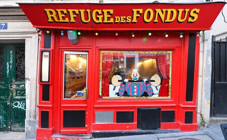 The traditional French restaurant Refuge des Fondus located in Montmartre in 18 district of Paris, France.のeditorial素材