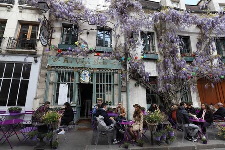 The traditional French cafe Au viex Paris dArcole decorated with flowers ,Paris, France.のeditorial素材