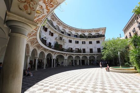 Plaza del Cabildo is a public space located near the cathedral where every Sunday a market of old coins and stamps is held, Seville, Spain.のeditorial素材