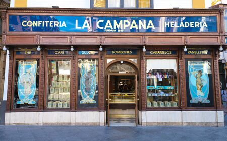 The facade of famous and oldest pastry shop La Campana in the historic city centre of Seville, Spain.のeditorial素材