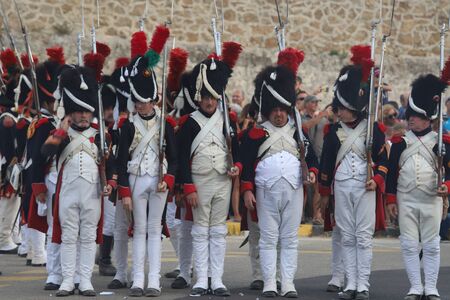 The reenactors dressed as Napoleon epoch soldiers for celebration the Napoleon birthday who was born...
