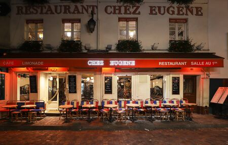 The famous Cafe Chez Eugene at night . It is located in the Montmartre, Paris, France.のeditorial素材
