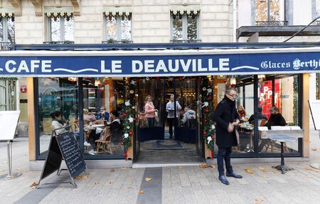 Le Deauville is traditional French cafe located in historical centre of Paris on Champs Elysees avenue .のeditorial素材