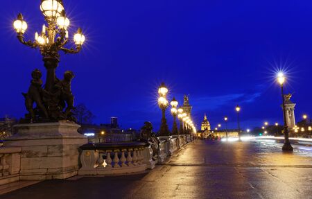 The famous Alexandre III bridge at night, Paris, Franceの写真素材