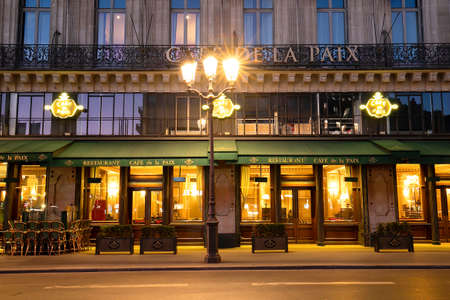 The famous cafe de la Paix located near opera house -Garnier palace in Paris, France. It had been inaugurated on May 5th , 1862.のeditorial素材