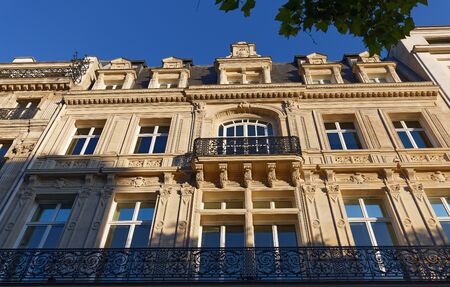 Traditional French house with typical balconies and windows. Paris.の写真素材