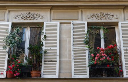 Paris windows with flowers on Montmartre street.Paris.の写真素材