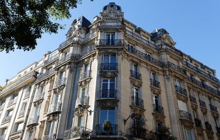 Traditional French house with typical balconies and windows. Paris, France.の写真素材