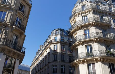 Traditional French houses with typical balconies and windows. Paris.の写真素材