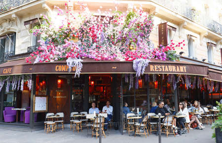 The vintage cafe Comptoir decorated with flowers , Paris, Franceのeditorial素材