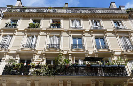 Traditional French house with typical balconies and windows. Paris.の写真素材