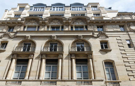 Traditional French house with typical balconies and windows. Paris.の写真素材