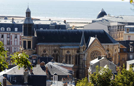 The view on roofs and Notre Dame church in Trouville city in Normandy.の写真素材
