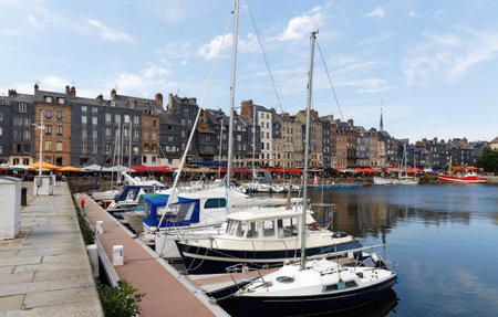 Honfleur harbour in Normandy, France. Color houses and their reflection in water.の写真素材