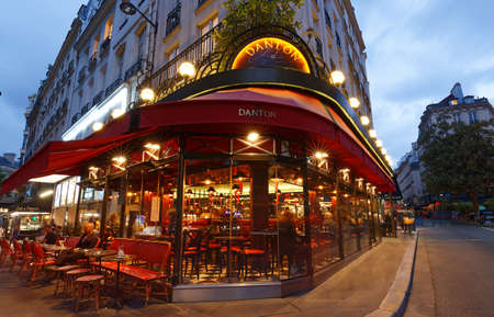 The traditional French cafe Danton at night . It located in Saint German district in Paris.のeditorial素材