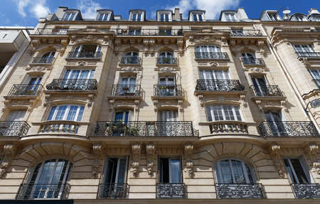 Traditional French house with typical balconies and windows. Paris.の写真素材
