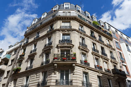 Traditional French house with typical balconies and windows. Paris.の写真素材