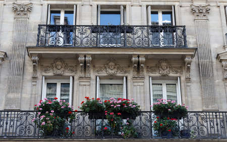 Traditional French house with typical balconies and windows. Paris.の写真素材
