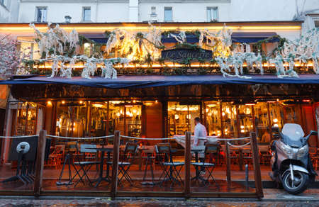 The Cafe Le Sancerre at rainy morning . It is a traditional French cafe in the Montmartre district, Paris, France.のeditorial素材