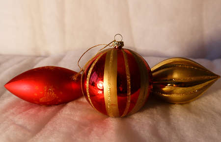 Three red christmas balls on snow backgroundの写真素材