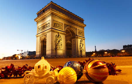 The famous Triumphal Arch at night and Christmas baubles. Paris. France.の写真素材