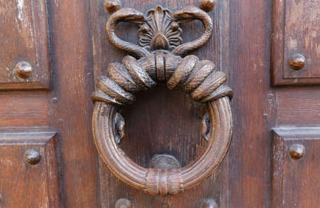 European Vintage old metal wrought iron door knocker. Design detail. Paris.の写真素材